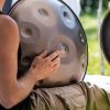 man playing a trAaditional steel handpan